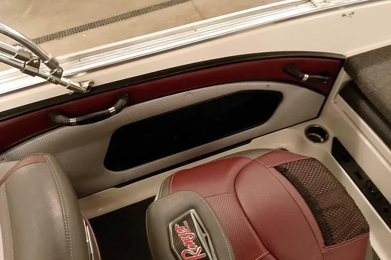 Slide: The Image of 2020 Ranger 1850MS Reata boat interior with red and gray seating and chrome accents. - 43