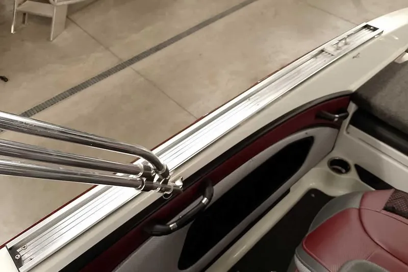 Slide: The Image of 2020 Ranger 1850MS Reata boat interior with chrome details and red seating. - 45