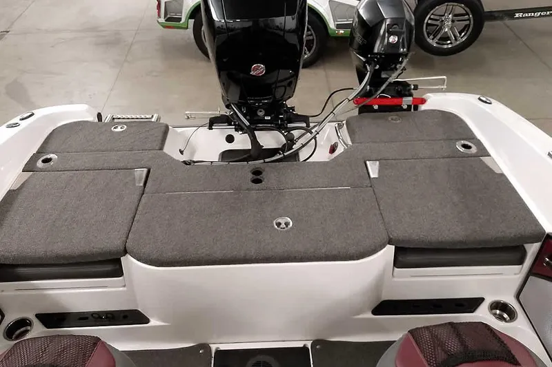 Slide: The Image of 2020 Ranger 1850MS Reata boat interior with cushioned seating and motor. - 46