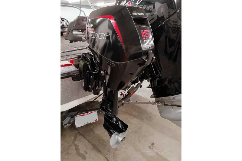 Slide: The Image of 2020 Ranger 1850MS Reata with Mercury Pro Kicker 15HP outboard motor in a garage. - 6