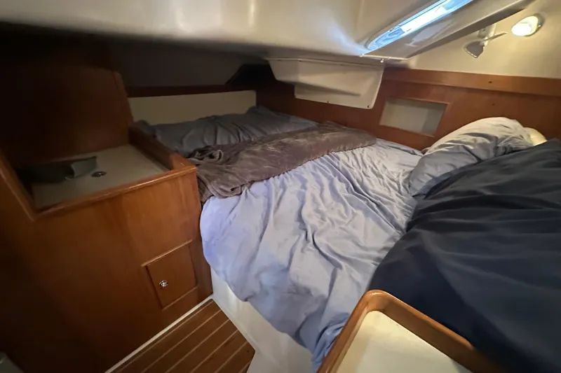 Slide: The Image of Cozy cabin interior of a 2003 Catalina 350 sailboat with a comfortable bed. - 32