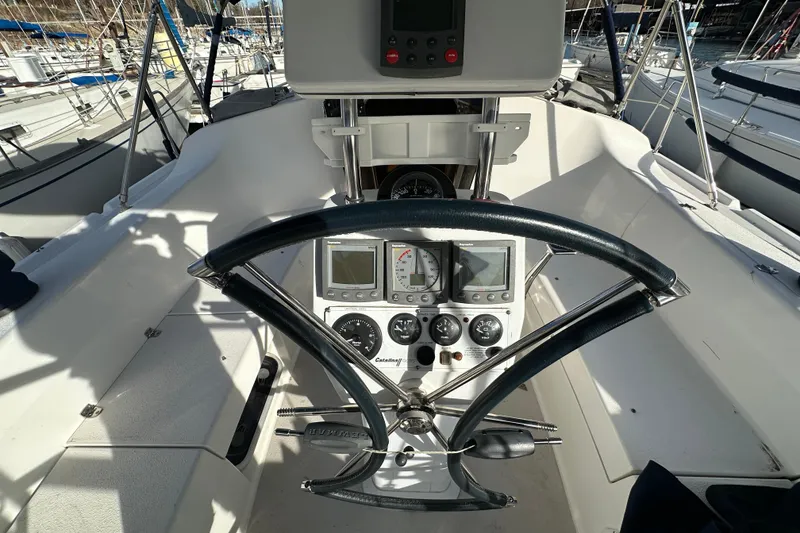 Slide: The Image of Cockpit of 2003 Catalina 350 sailboat with steering wheel and navigation instruments. - 6