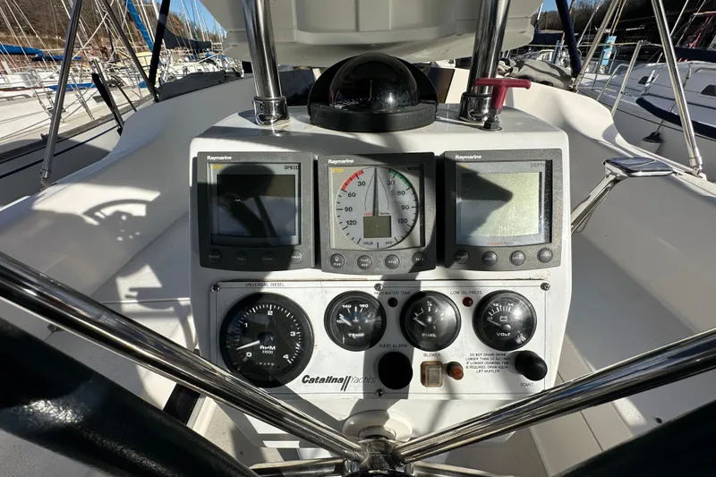 Slide: The Image of Cockpit of 2003 Catalina 350 sailboat with navigation instruments and controls. - 7