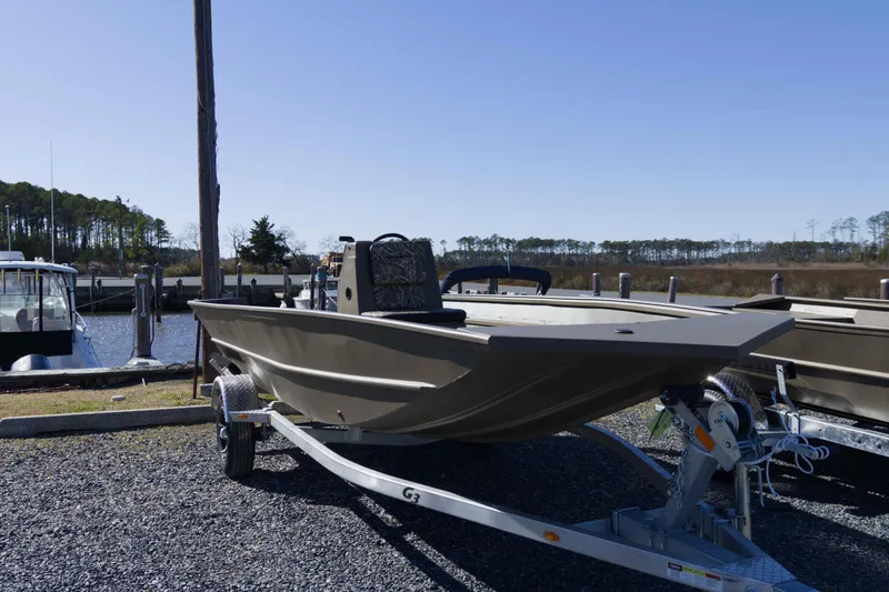 Slide: The Image of 2026 G3 Gator Tough 17 CC boat on trailer at marina. - 7