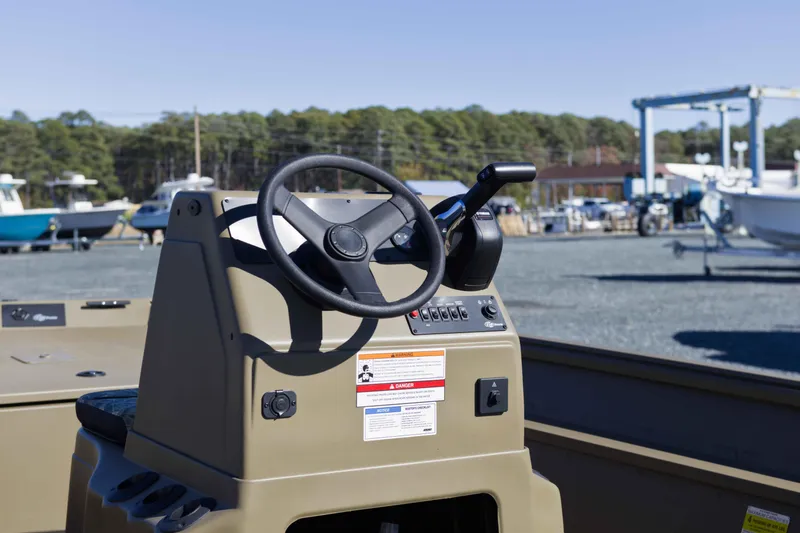 Slide: The Image of 2026 G3 Gator Tough 17 CC boat console with steering wheel and controls. - 8