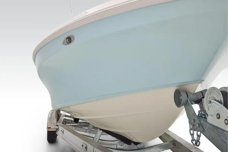 Slide: The Image of 2026 Mako 24 APEX boat on trailer, showcasing sleek hull design. - 10