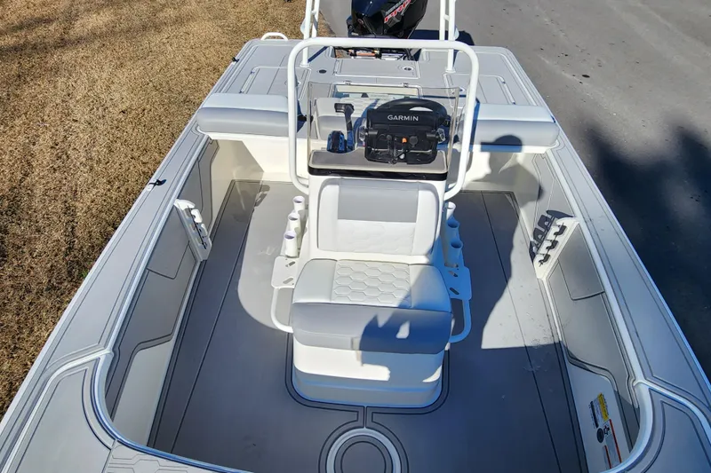 Slide: The Image of 2026 Mako 18 Pro Skiff boat interior with Garmin navigation system. - 12
