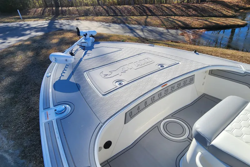 Slide: The Image of 2026 Mako 18 Pro Skiff boat deck with seating and measurement markings. - 8