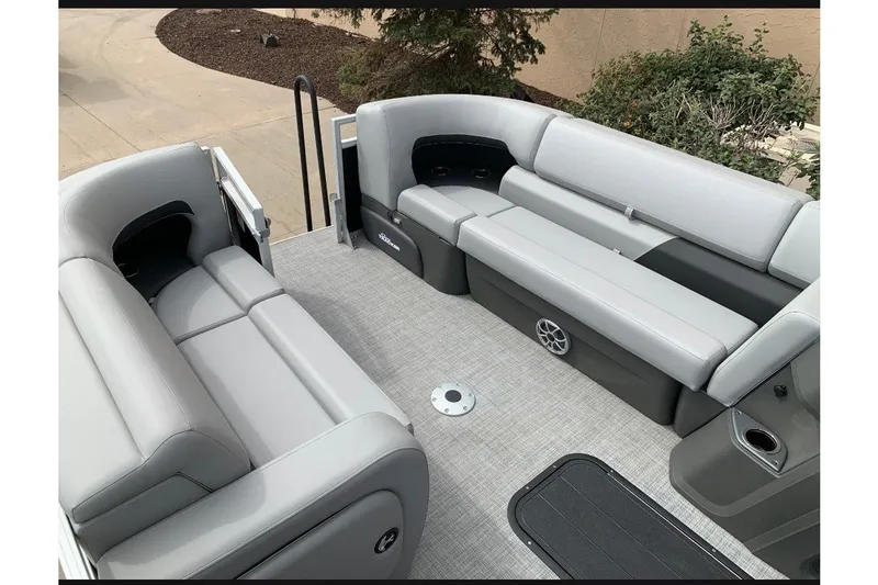 The Image of Interior view of 2026 Sun Tracker SportFish 22 XP3 pontoon boat with gray seating. - 0