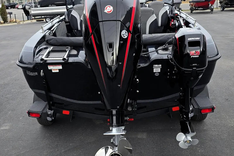 Slide: The Image of 2026 Nitro ZV19 Sport Pro boat with dual Mercury engines, parked on pavement. - 62