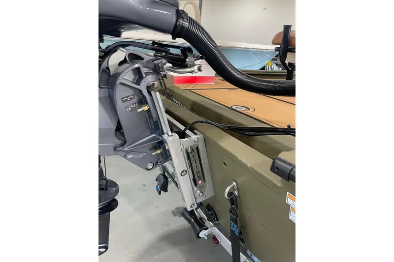 Slide: The Image of Avid 20 ROGUE CC 2026 boat motor and mounting details in a garage setting. - 15