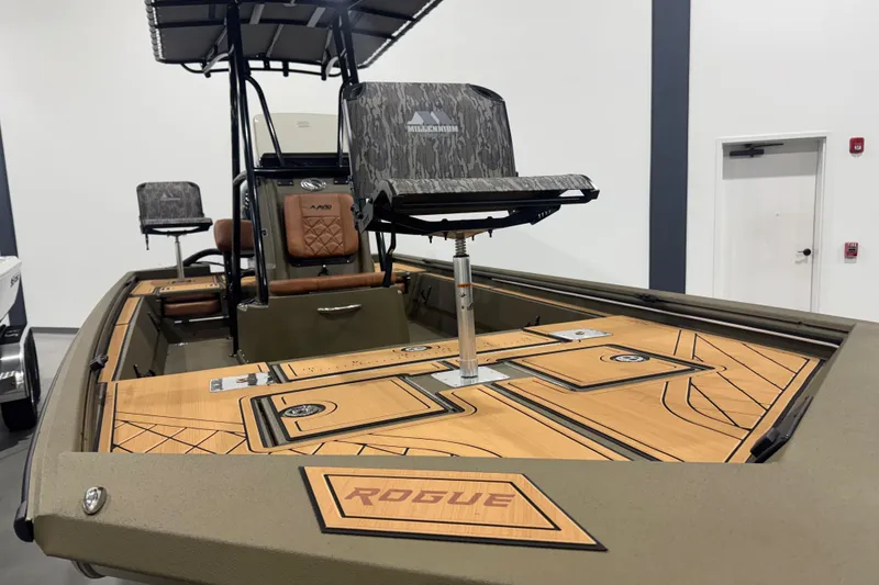 Slide: The Image of 2026 Avid 20 Rogue CC boat with camo seating and sleek deck design. - 20