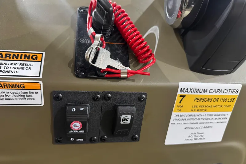 Slide: The Image of Control panel of 2026 Avid 20 Rogue CC boat with safety warnings and capacity details. - 23