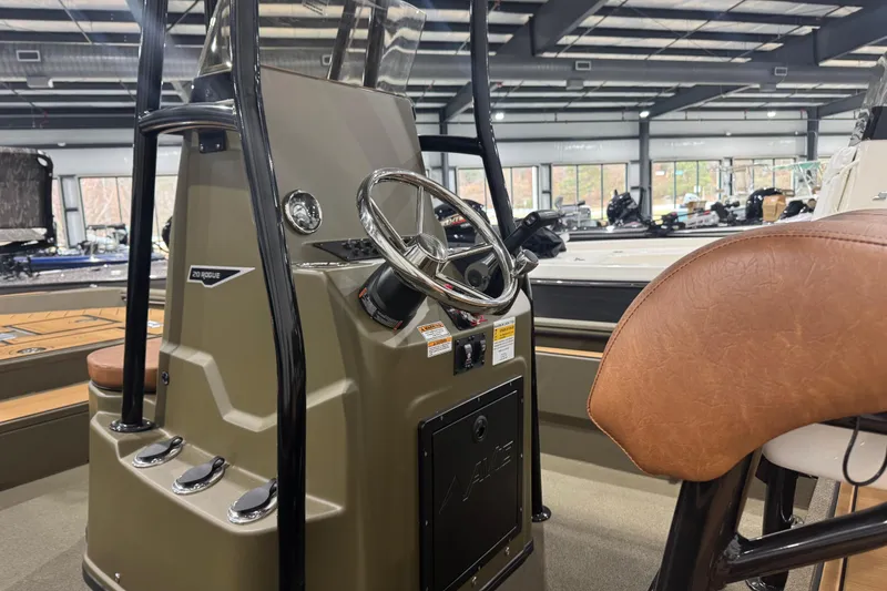 Slide: The Image of Interior of 2026 Avid 20 Rogue CC boat with steering wheel and seating. - 24