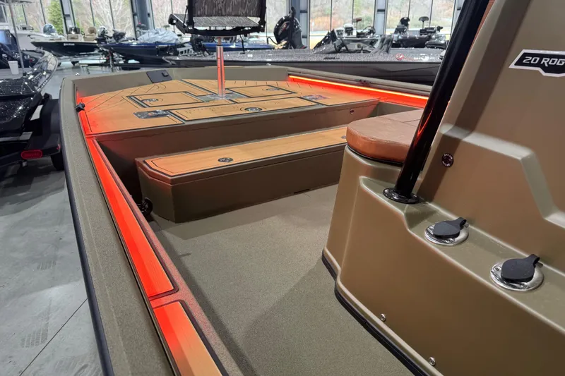 Slide: The Image of 2026 Avid 20 Rogue CC boat interior with red LED lighting and sleek design. - 26