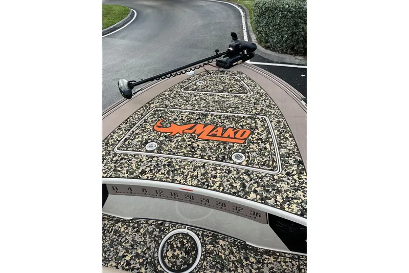 Slide: The Image of 2026 Mako 18 Pro Skiff Backwater Edition with camo design and trolling motor. - 10