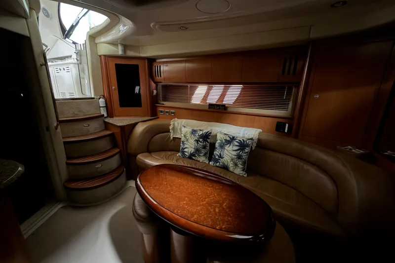 Slide: The Image of Luxurious interior of 2006 Sea Ray 44 Sundancer yacht with leather seating and wooden accents. - 10