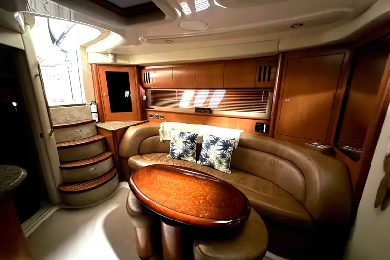 Slide: The Image of Luxurious interior of 2006 Sea Ray 44 Sundancer yacht with elegant seating and wooden finishes. - 11