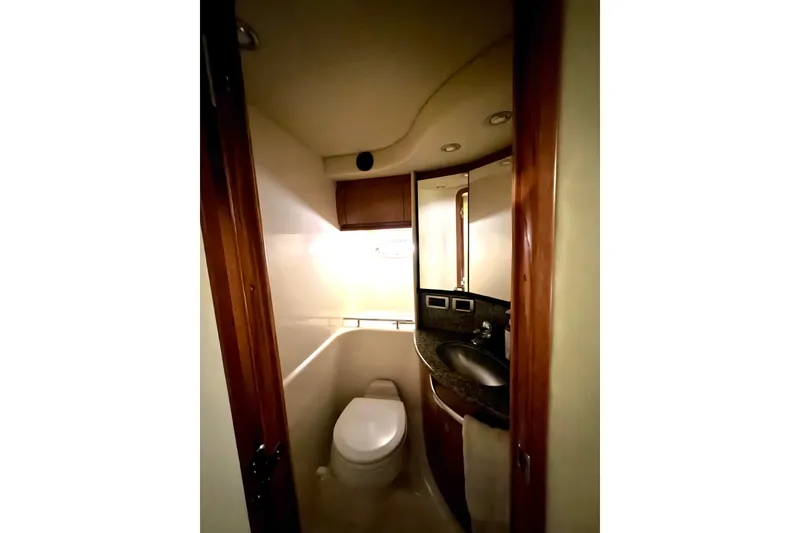 Slide: The Image of Bathroom interior of 2006 Sea Ray 44 Sundancer yacht, featuring toilet and sink. - 16