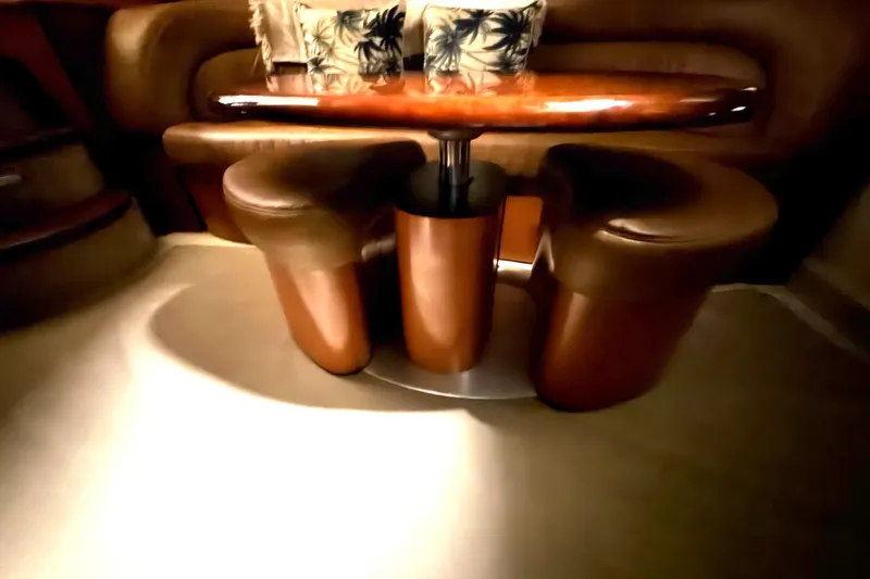 Slide: The Image of Luxurious interior of 2006 Sea Ray 44 Sundancer yacht with elegant seating and table. - 17