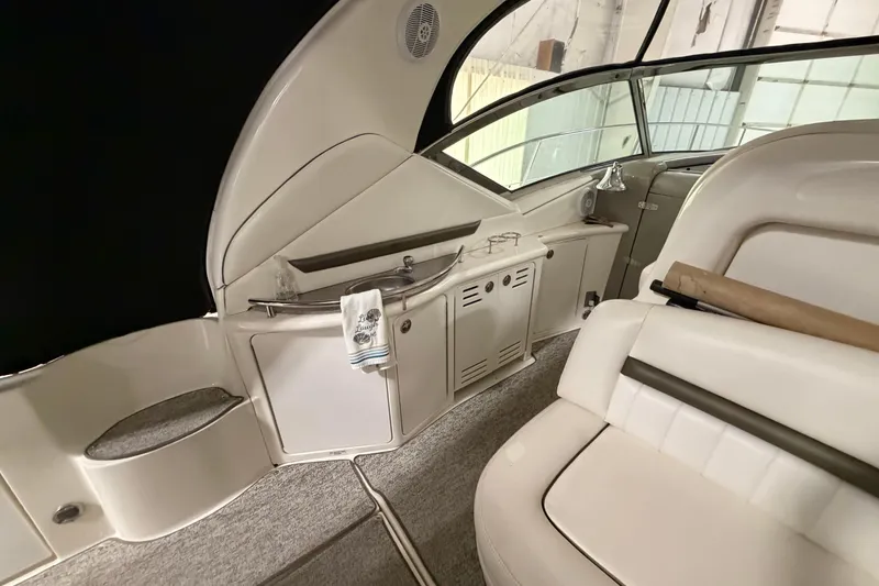 Slide: The Image of 2006 Sea Ray 44 Sundancer interior with seating and kitchenette area. - 6