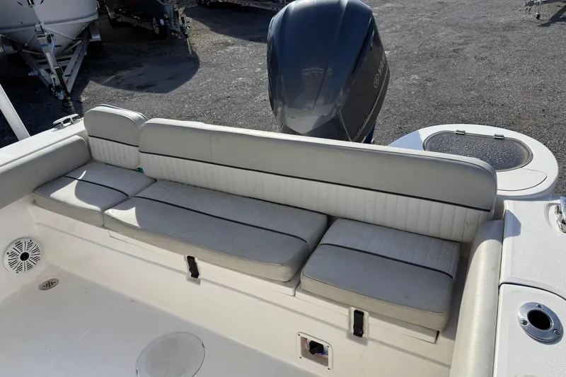 Slide: The Image of 2021 Sea Fox 249 Avenger boat with cushioned seating and Yamaha outboard motor. - 12