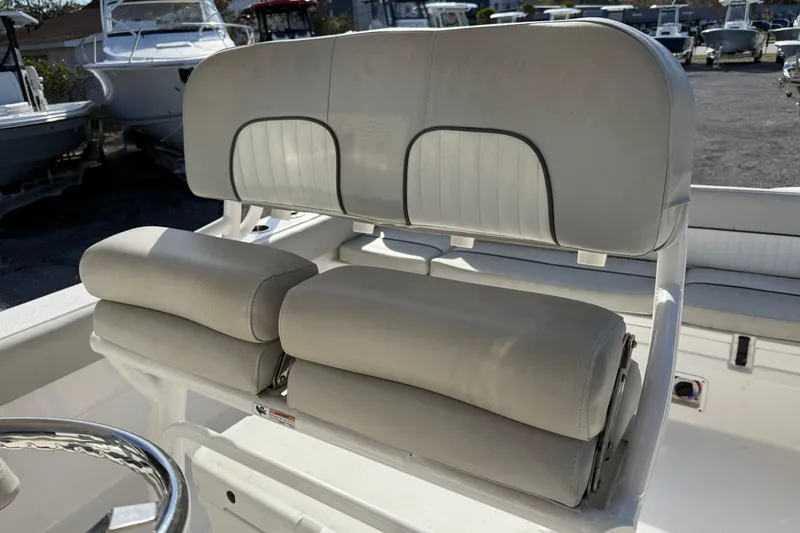 Slide: The Image of 2021 Sea Fox 249 Avenger boat seating with cushioned backrest and armrests. - 13