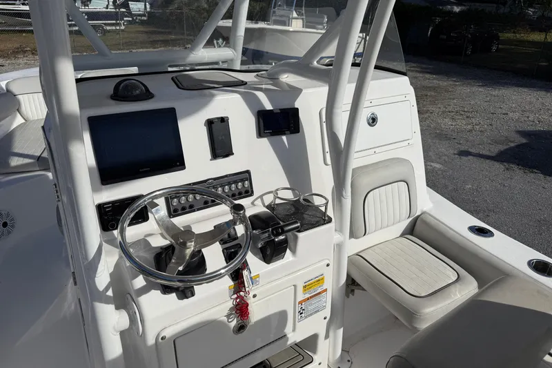 Slide: The Image of 2021 Sea Fox 249 Avenger boat console with steering wheel and navigation equipment. - 14
