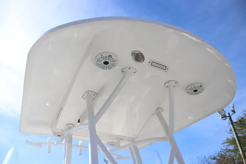 Slide: The Image of 2021 Sea Fox 249 Avenger boat canopy with speakers and blue sky background. - 6