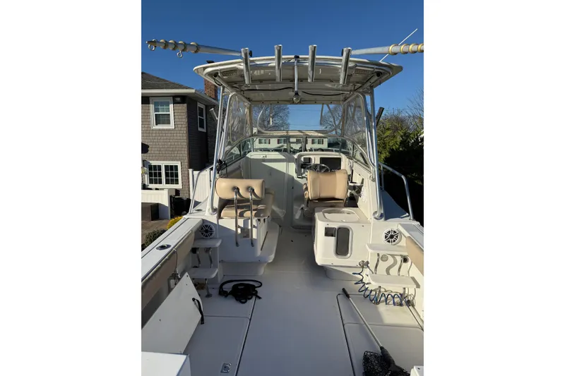 Slide: The Image of 2005 Glacier Bay 2670 Island Runner boat interior with seating and fishing equipment. - 4