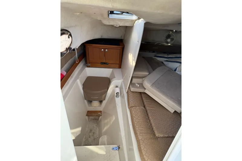 Slide: The Image of 2005 Glacier Bay 2670 Island Runner cabin interior with seating and storage. - 6
