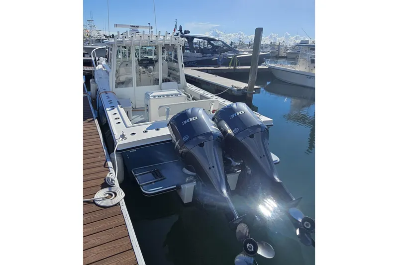 Slide: The Image of 2021 Steiger Craft 31 Miami boat with dual 300 horsepower engines docked at marina. - 1