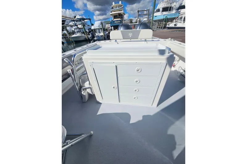 Slide: The Image of 2021 Steiger Craft 31 Miami boat interior with storage drawers, docked at marina. - 10