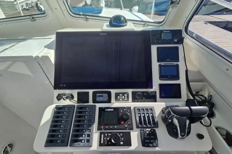 Slide: The Image of Steiger Craft 31 Miami 2021 boat dashboard with navigation and control systems. - 2