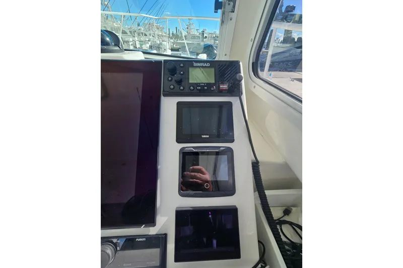 Slide: The Image of Steiger Craft 31 Miami 2021 boat dashboard with navigation and control panels. - 4