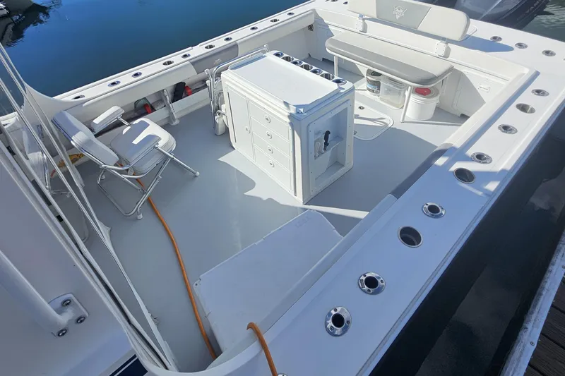 Slide: The Image of 2021 Steiger Craft 31 Miami boat deck with seating and storage compartments. - 7