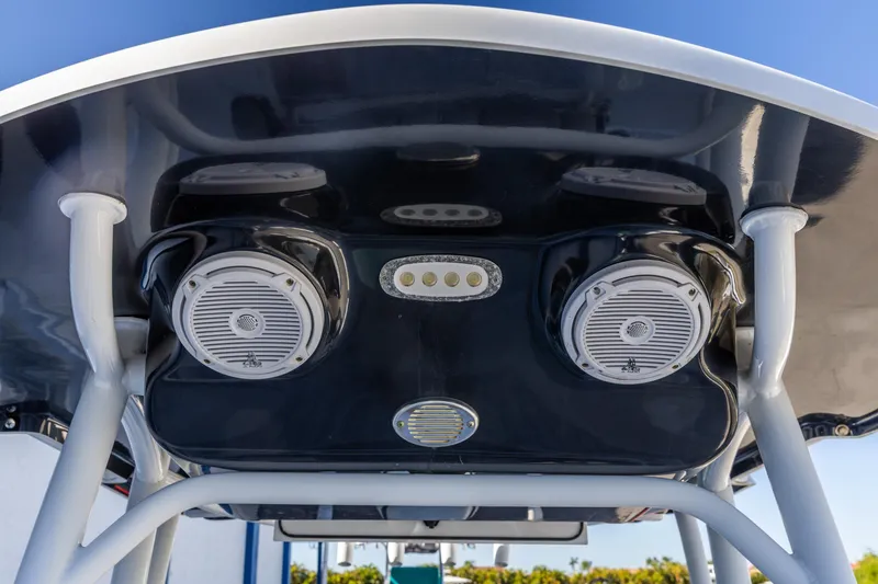 Slide: The Image of 2017 Sea Pro 248 Bay boat speakers and lights on T-top, close-up view. - 12
