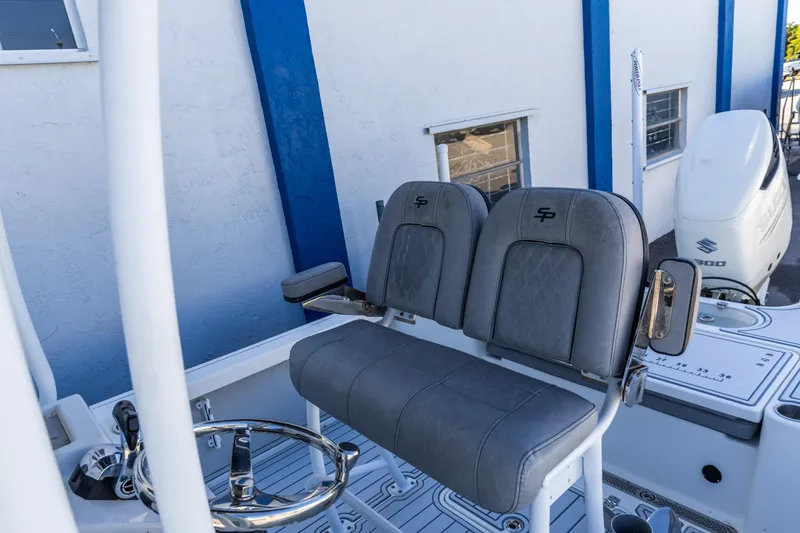 Slide: The Image of 2017 Sea Pro 248 Bay boat with dual seats and Suzuki engine. - 15