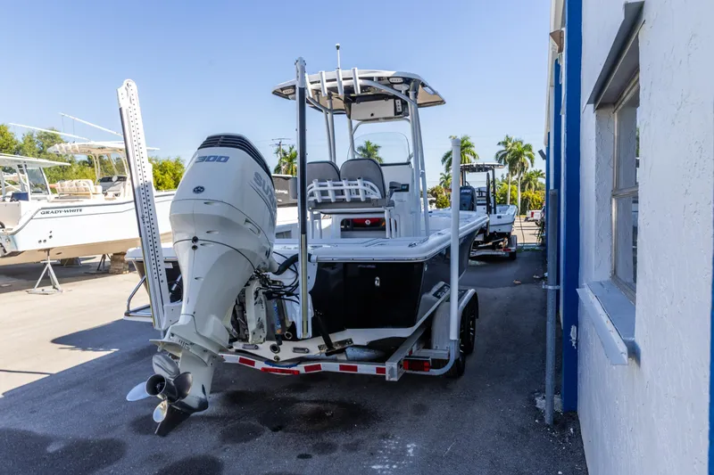 Slide: The Image of 2017 Sea Pro 248 Bay boat with outboard motor, parked outdoors. - 5