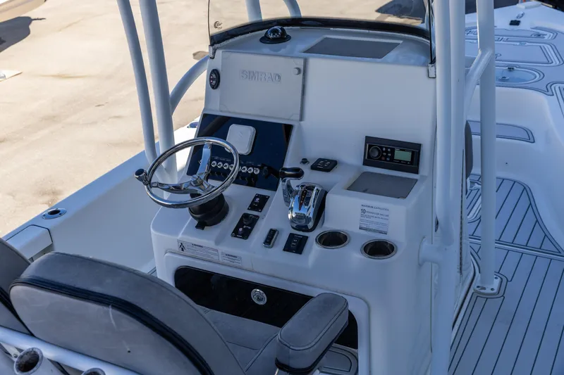 Slide: The Image of 2017 Sea Pro 248 Bay boat console with steering wheel and controls. - 7