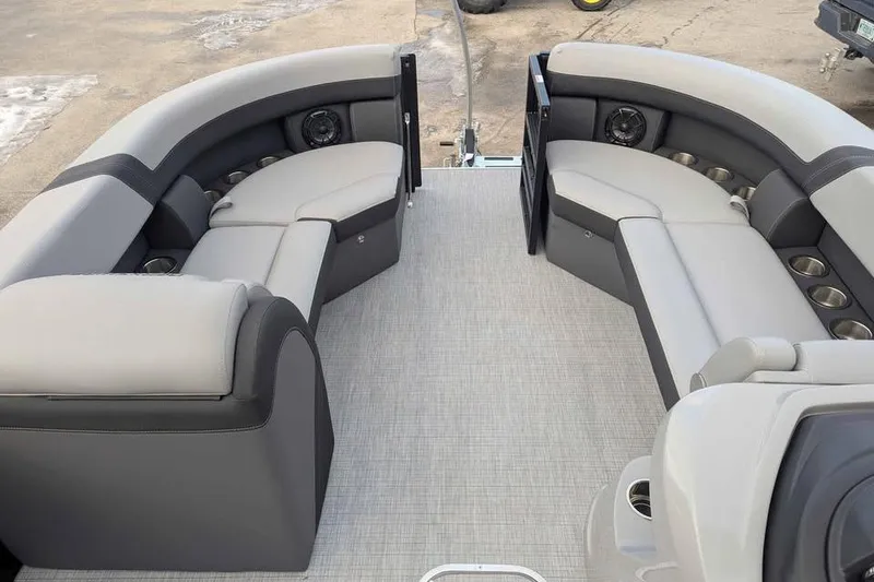 Slide: The Image of 2026 Berkshire 24RFX CTS pontoon boat interior with spacious seating and cup holders. - 10