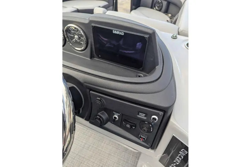 Slide: The Image of Dashboard of 2026 Berkshire 24RFX CTS boat with Simrad display and controls. - 13