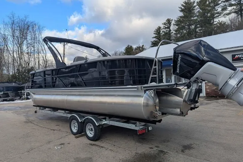 Slide: The Image of 2026 Berkshire 24RFX CTS pontoon boat on trailer, parked outdoors. - 4