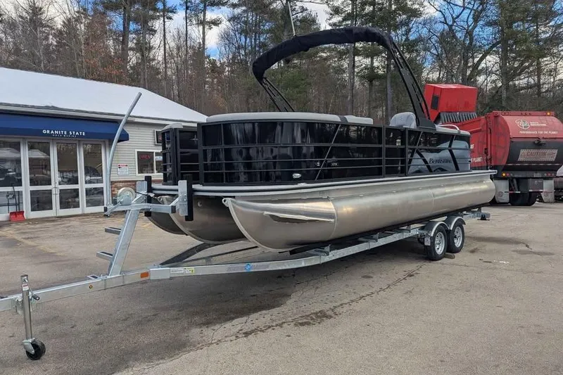 Slide: The Image of 2026 Berkshire 24RFX CTS pontoon boat on trailer in parking lot. - 5