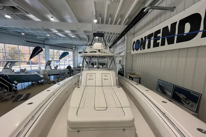 Slide: The Image of 2026 Contender 44 Fisharound boat in showroom. - 17