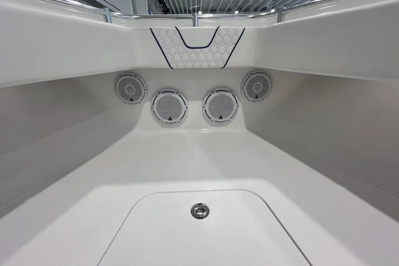 Slide: The Image of 2026 Contender 44 Fisharound boat interior with speakers and sleek design. - 19