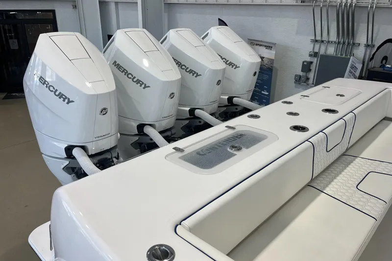 Slide: The Image of 2026 Contender 44 Fisharound with four Mercury Verado engines in showroom. - 20