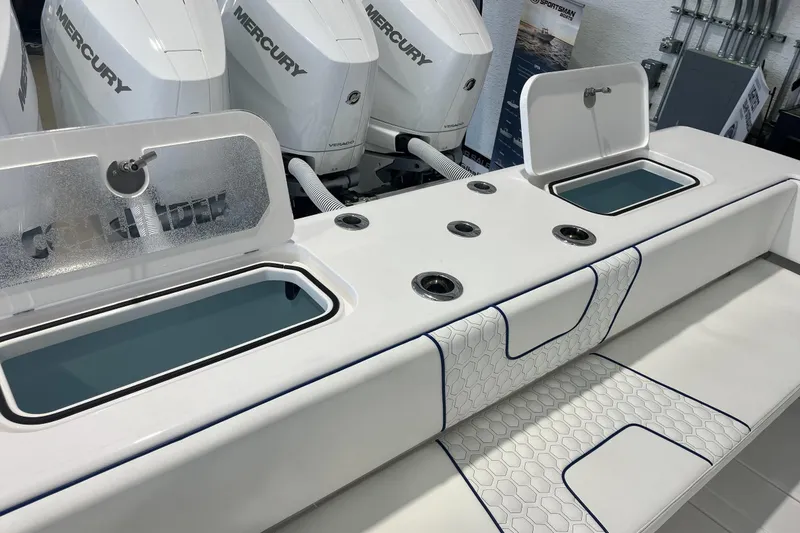 Slide: The Image of 2026 Contender 44 Fisharound boat with Mercury engines and sleek white seating. - 21