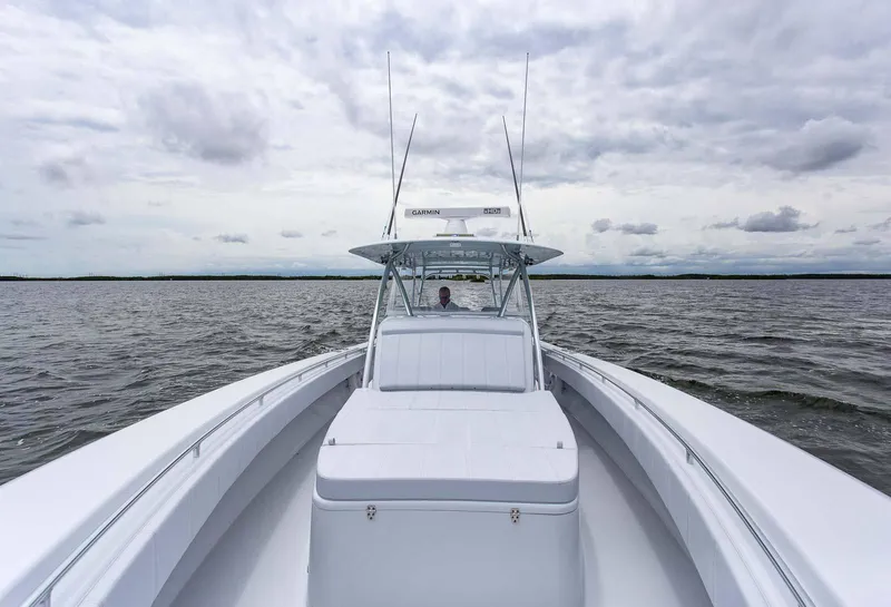 Slide: The Image of 2026 Contender 44 Fisharound boat interior with storage drawers and seating. - 7