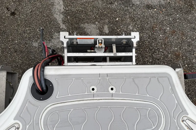 Slide: The Image of 2007 Yellowfin 24 Bay boat deck with wiring and metal components. - 10